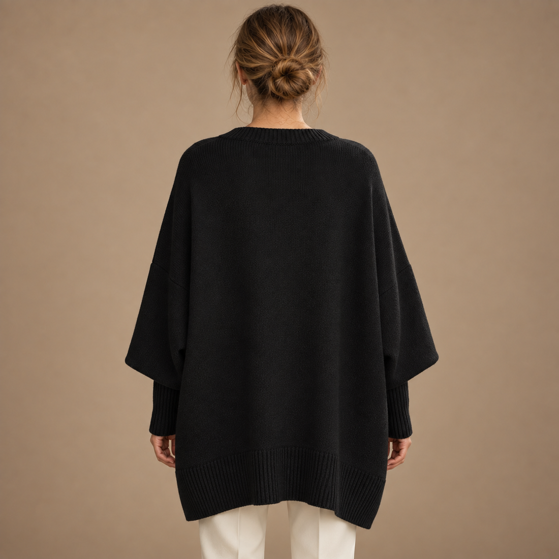 Oversized sweater til dame med asymmetrisk kant